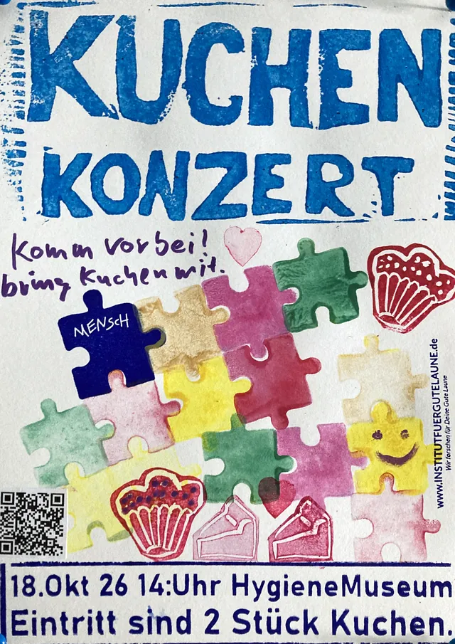 Plakat von Thomas: bunte Puzzleteile, eines mit der Aufschrift „Mensch“, dazu handschriftlich „Komm vorbei! bring Kuchen mit.“